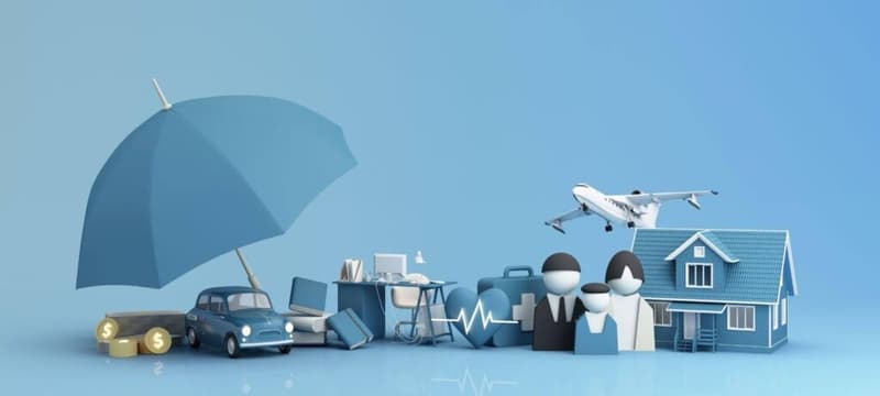 Insurance concept illustrated with a house airplane umbrella and money symbolizing coverage and protection